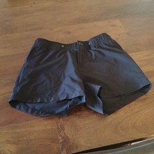 Black athletic shorts with zipper pockets